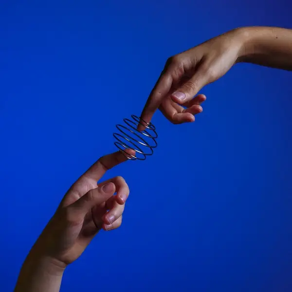 two fingers reaching to each other