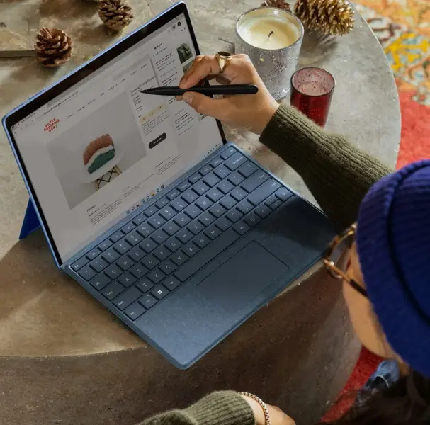 graphic designer drawing on laptop